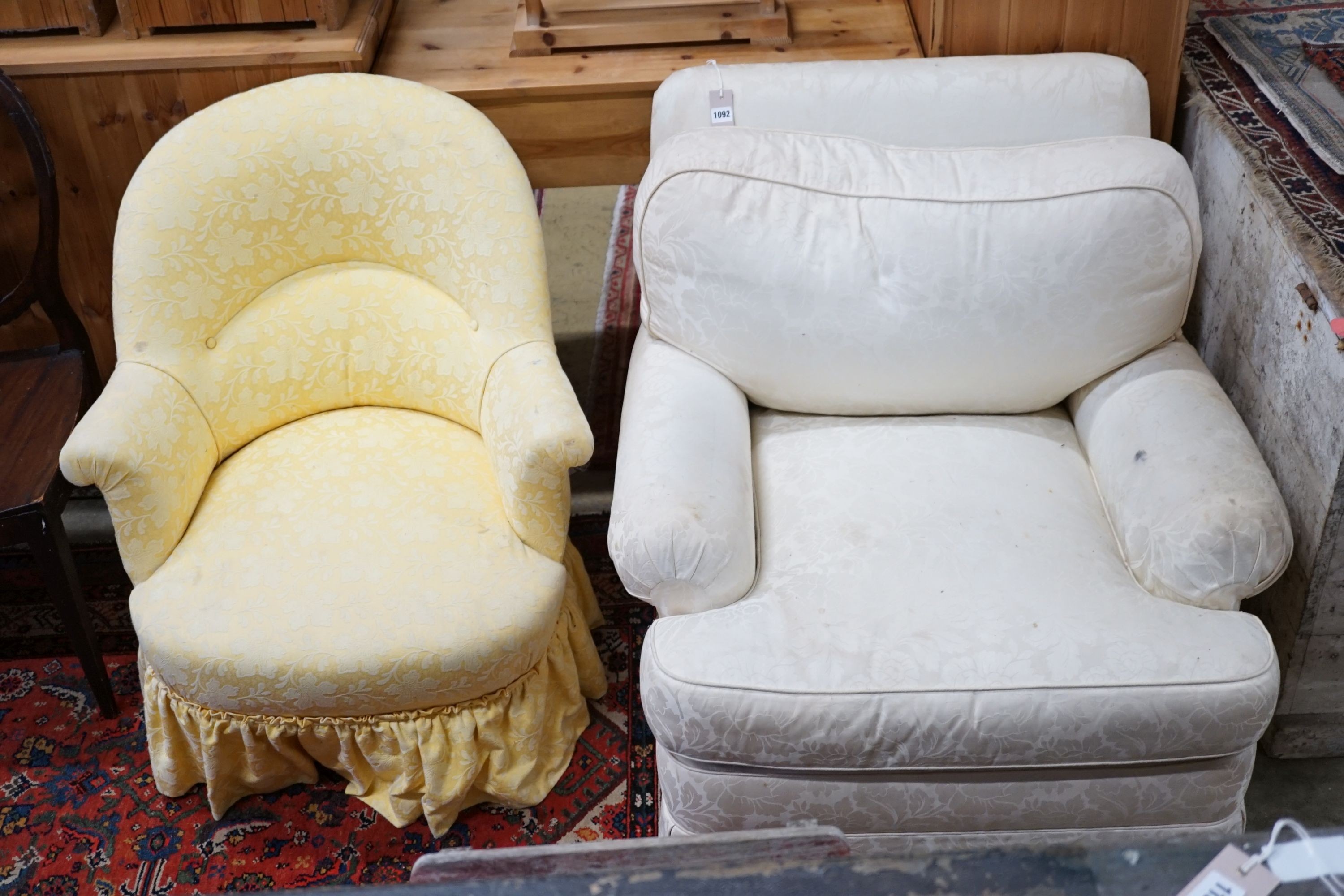 A brown leather upholstered desk chair, a mahogany hall chair and two upholstered armchairs